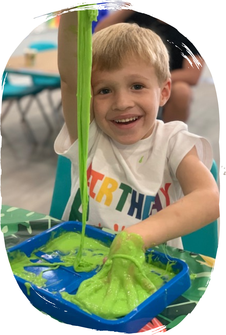 Child creating clay sculpture during camp