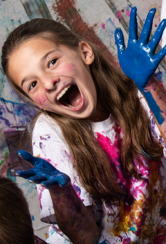 Teacher guiding kids through creative art project