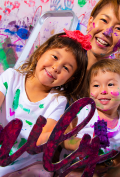 Teacher guiding kids through creative art project